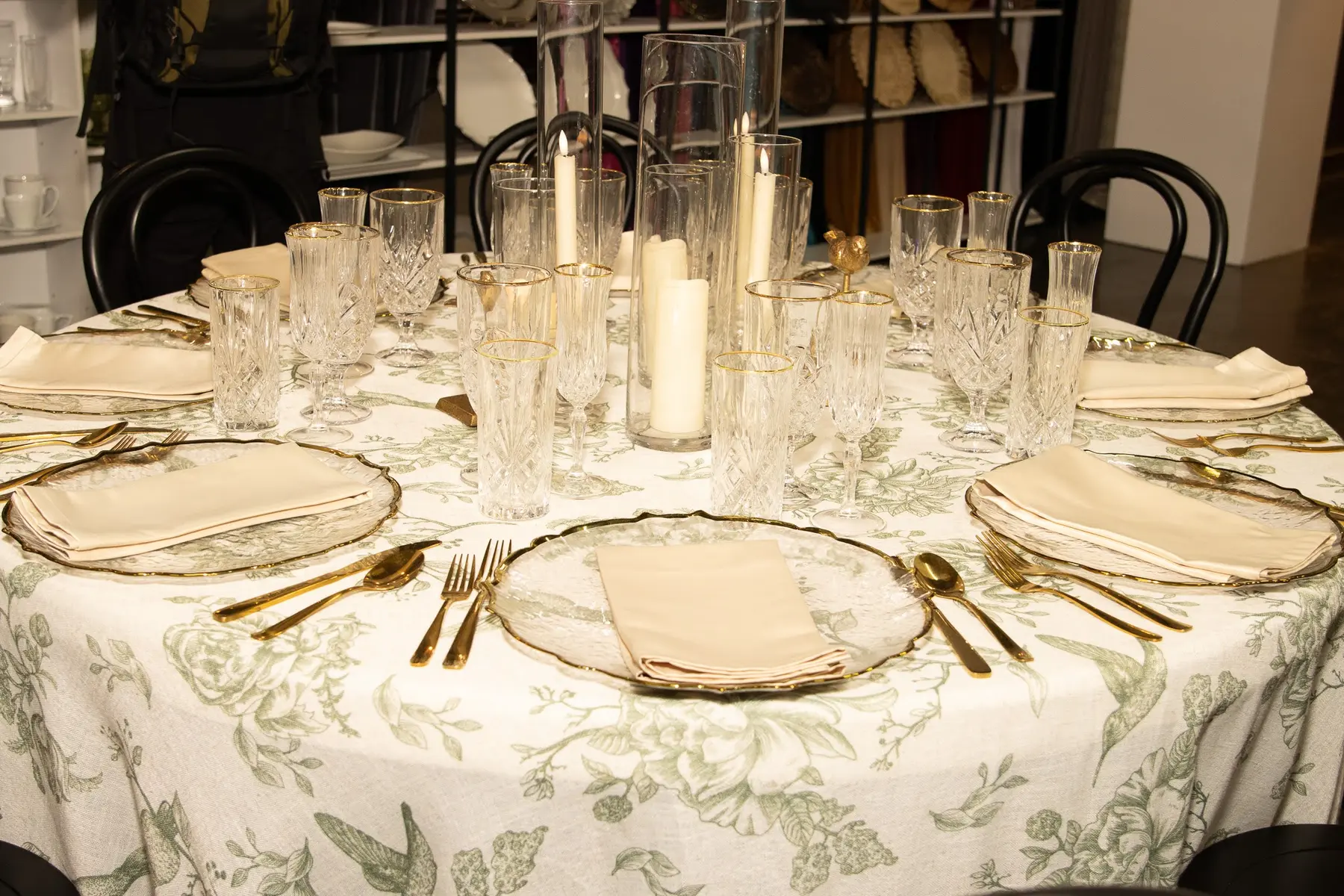 Layered glassware and candlelight tablescape detail